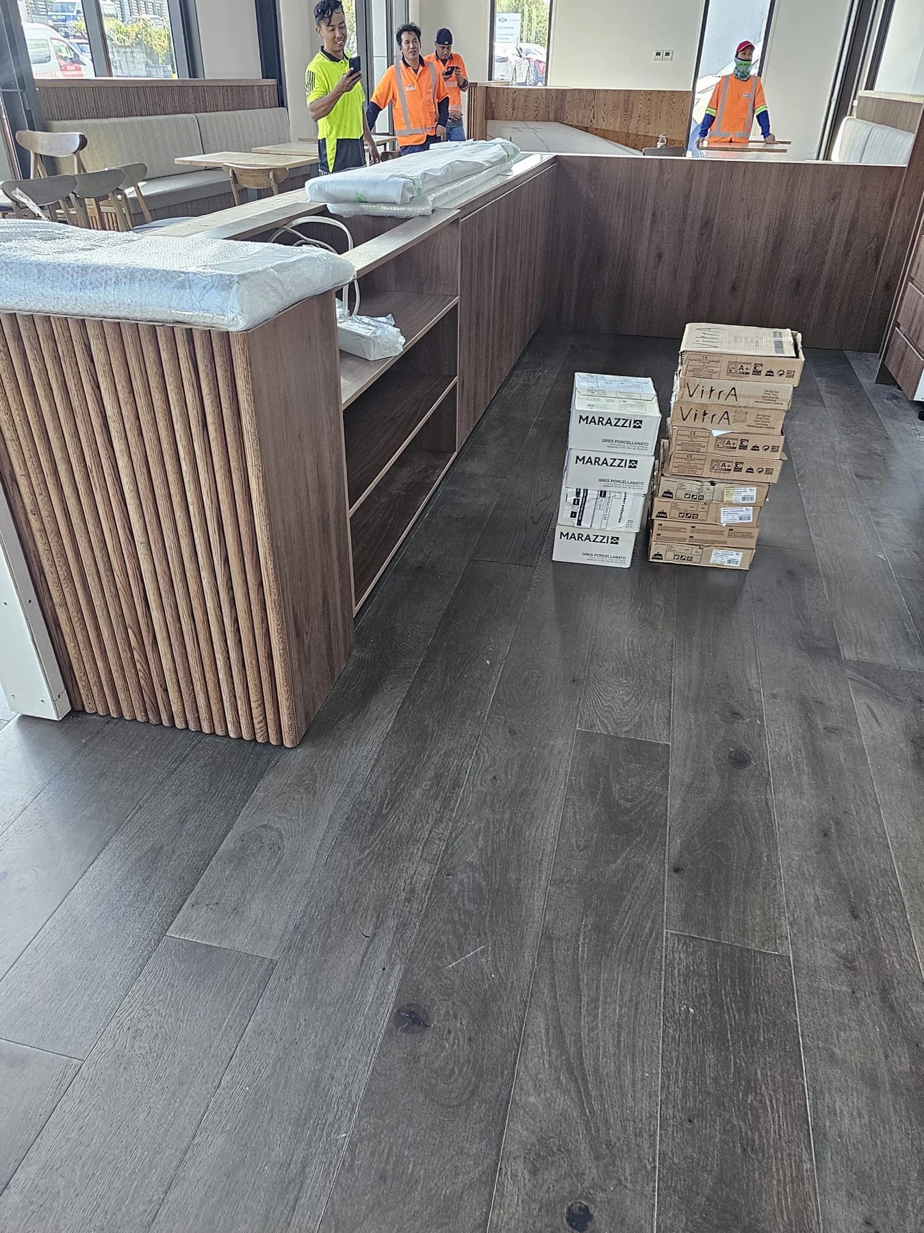 Timber-look counter and interior fit-out, photographed during the work.