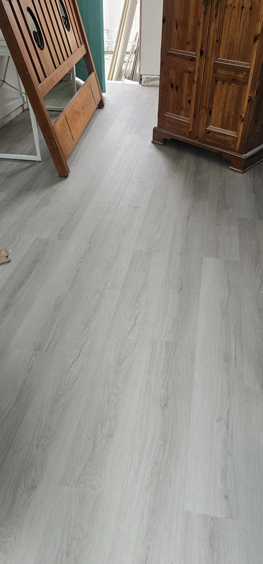 Light wood-look flooring in a residential interior.