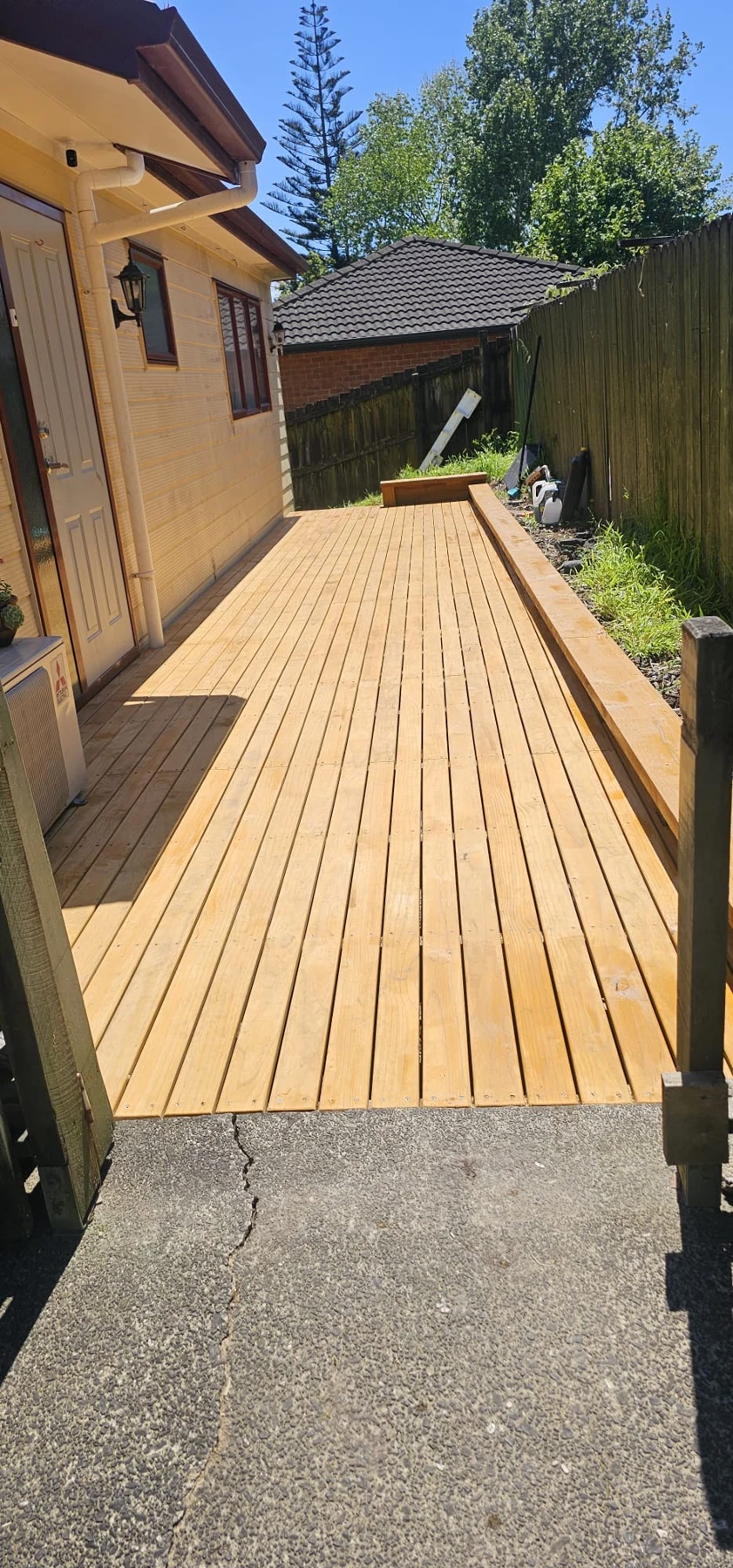Timber decking beside a residential property.